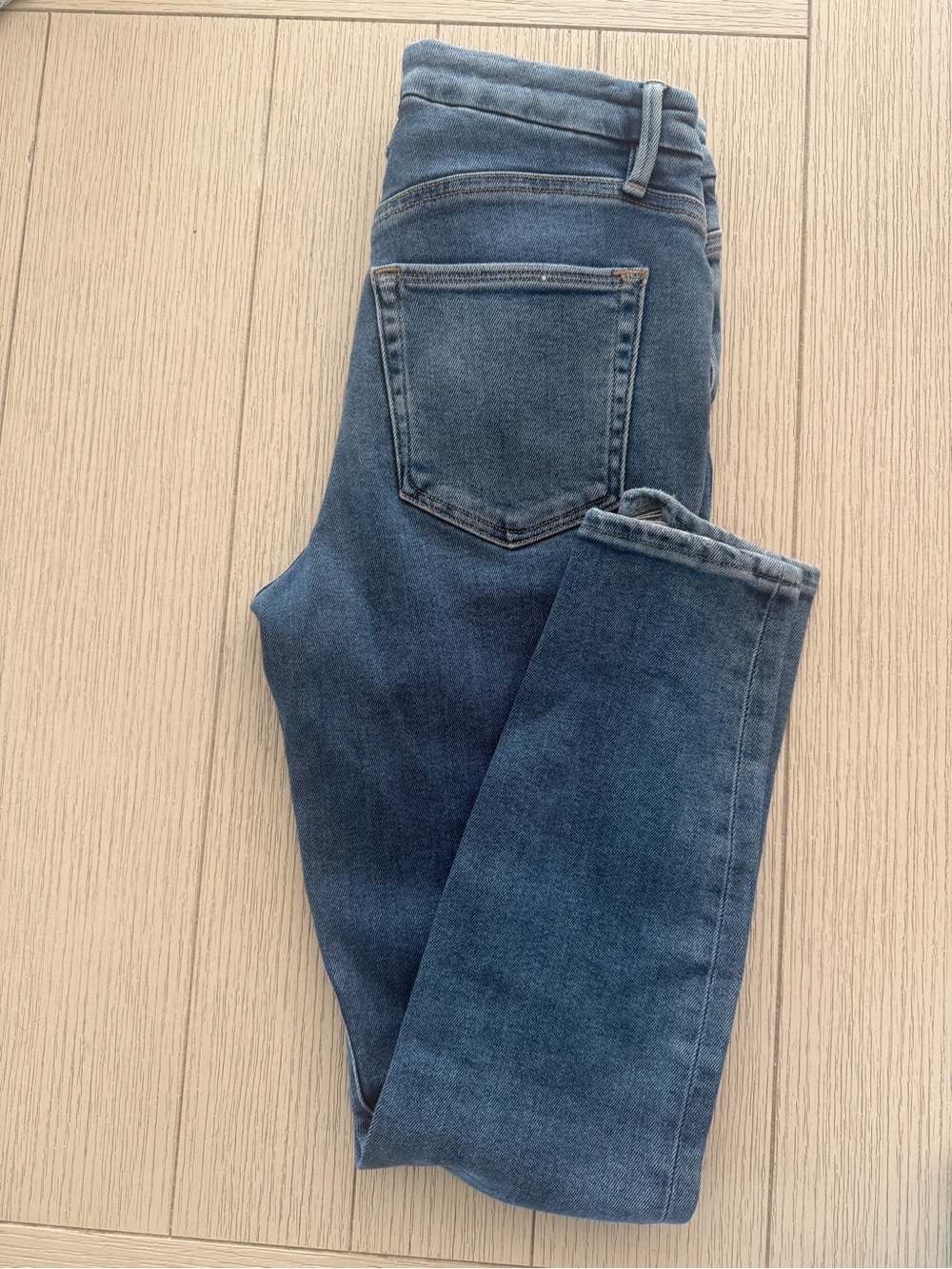 Good American light blue denim jeans with button detail